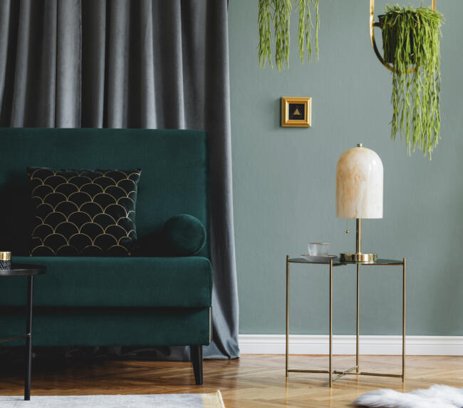 stylish composition luxury apartment living room interior with design sofa coffee table accessories green walls wooden parquet » StayBooked